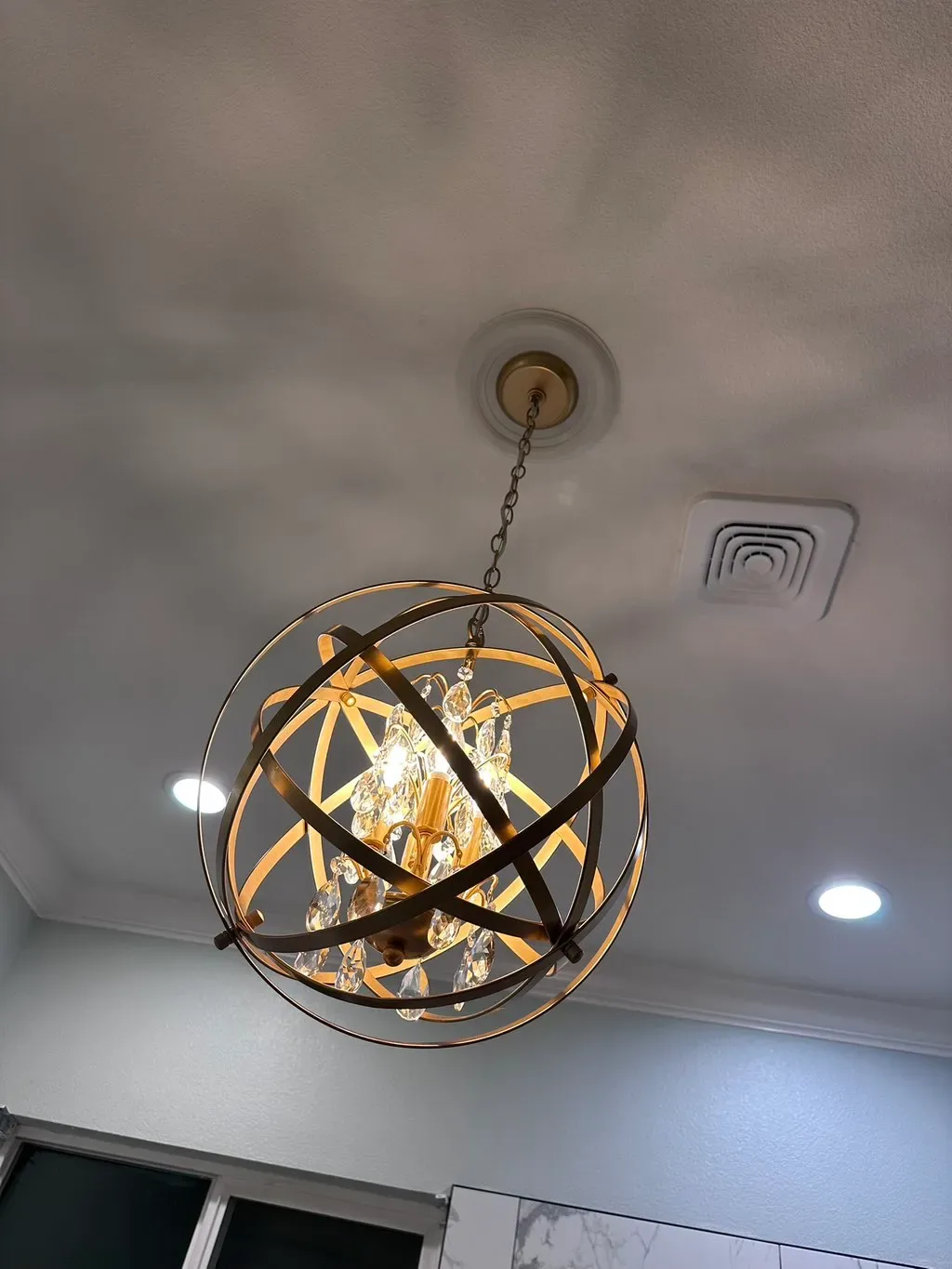 Recessed ceiling lights around a finished fixture