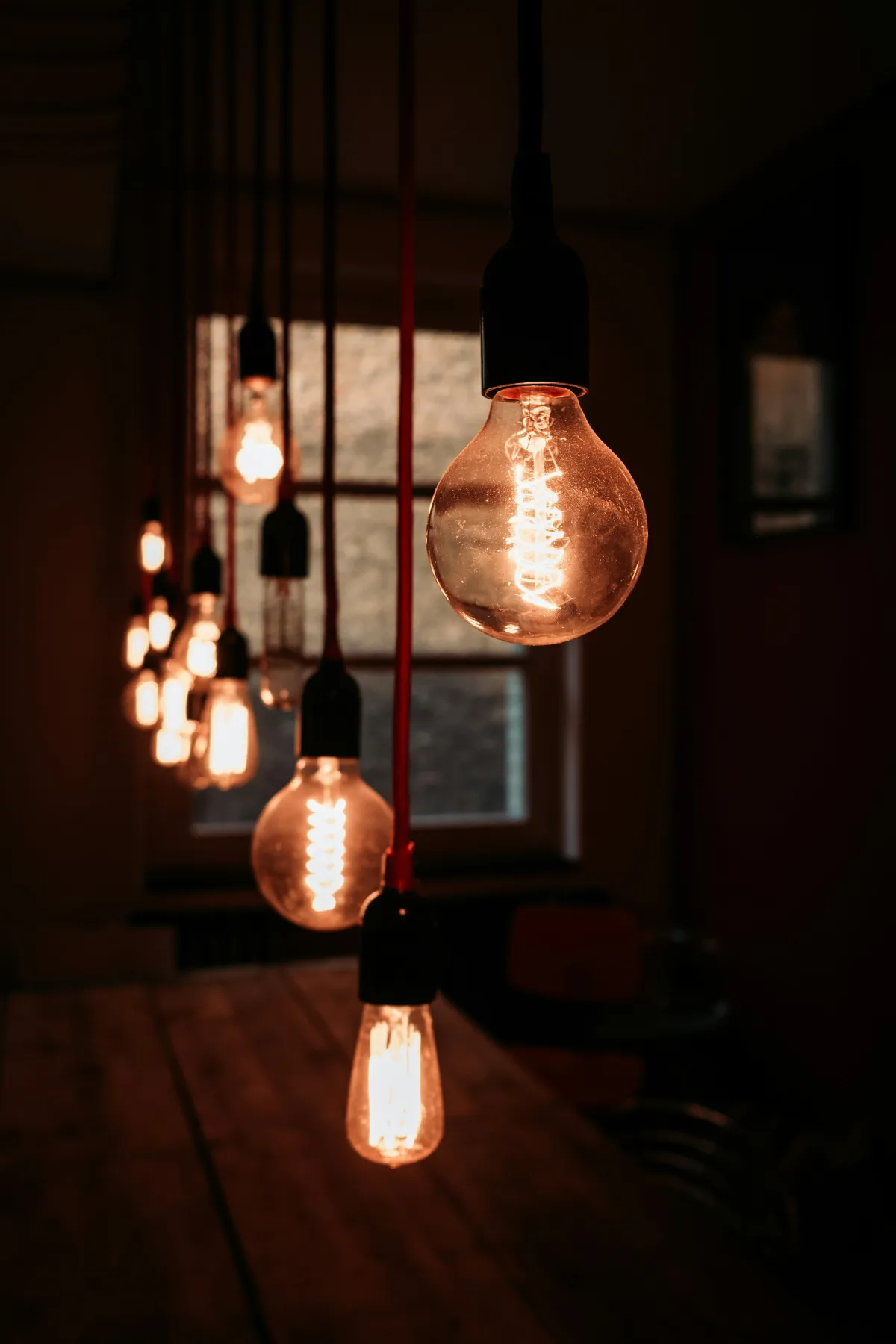 Warm pendant lights glowing in a row