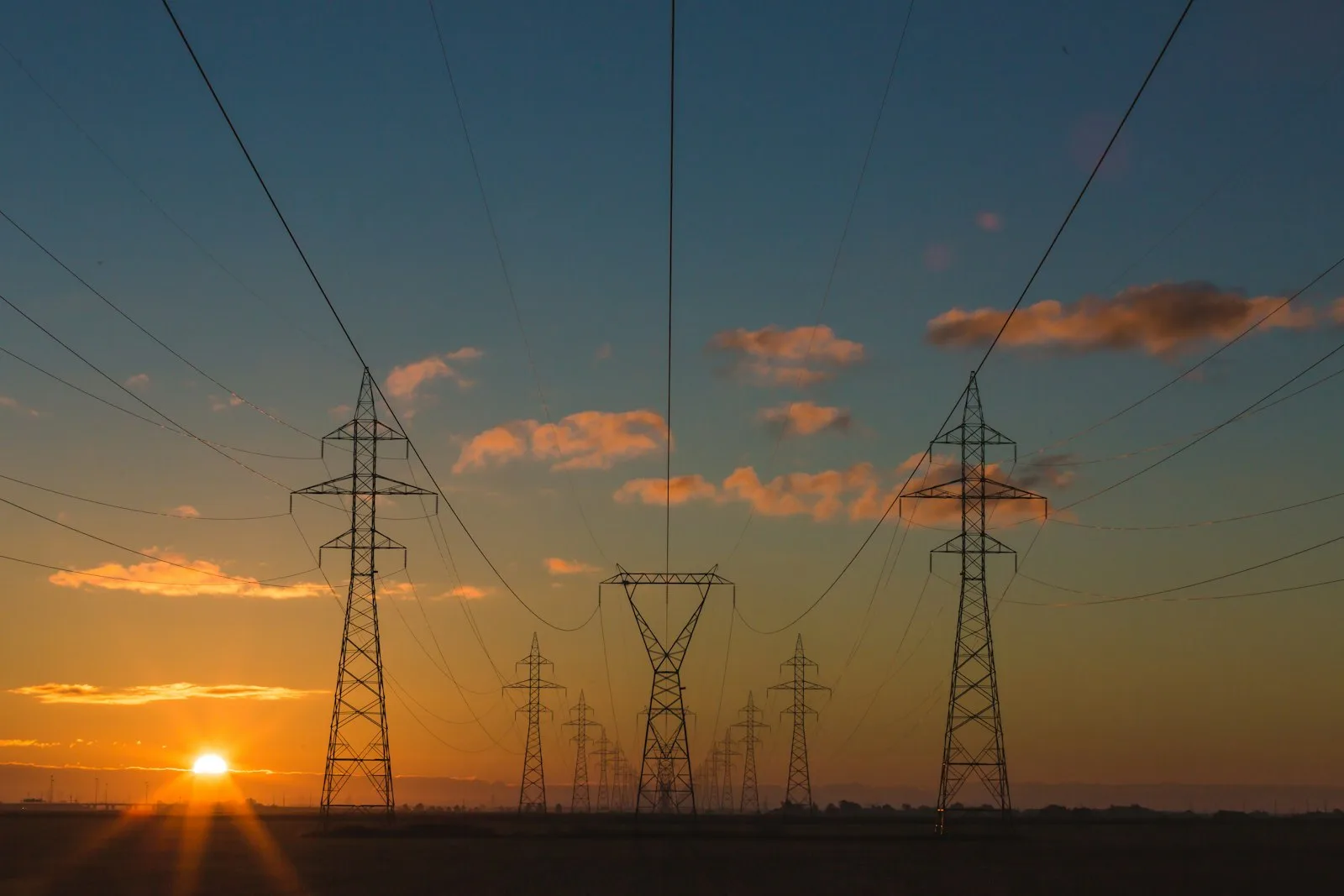 Utility transmission lines at sunset